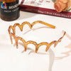 A set of tortoiseshell fashion acetate toothed headbands displayed on a white background.