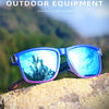 Blue gradient square polarized sunglasses resting on a rocky surface with a blurred outdoor background.