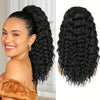 A woman shows off long, black curly drawstring ponytail hair extensions in a high ponytail.