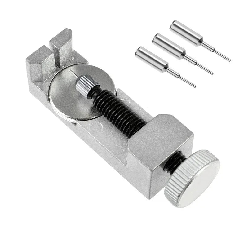 A silver precision watch link pin remover tool set with three tapered pins and a main body.