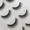 A collection of black handmade mink strip eyelashes displayed on a white surface.
