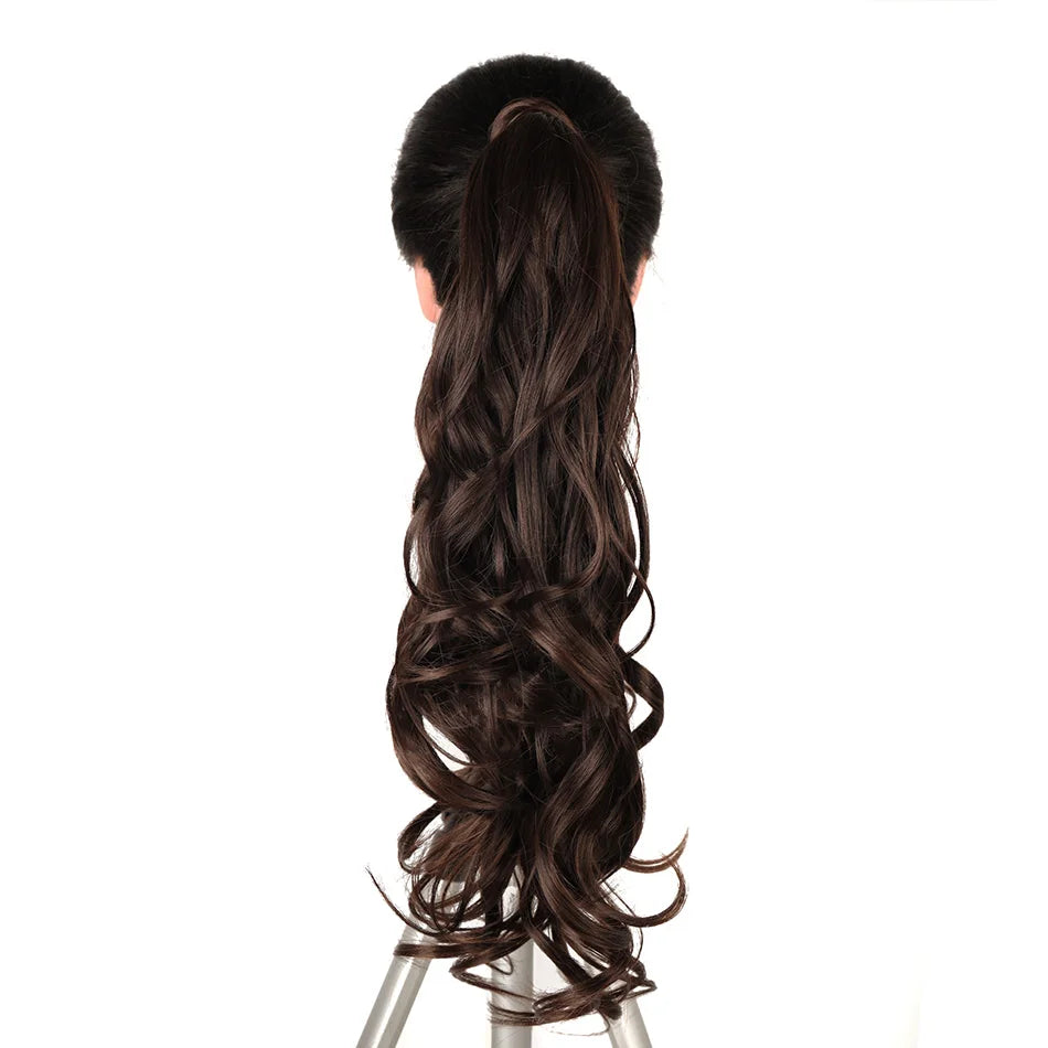 A dark brown hair extension styled in a long, voluminous braid or wrap around style.