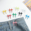 A collection of star-shaped decorative waist buckle buttons in various colors including yellow, orange, green, black, white, 
