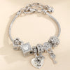 Silver multi-element beaded love bracelet set featuring hearts and charms