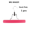 A single dark pink wooden wig hanger with a metal hook and bar.
