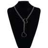 A chunky heart slip chain necklace displayed on a black display stand.