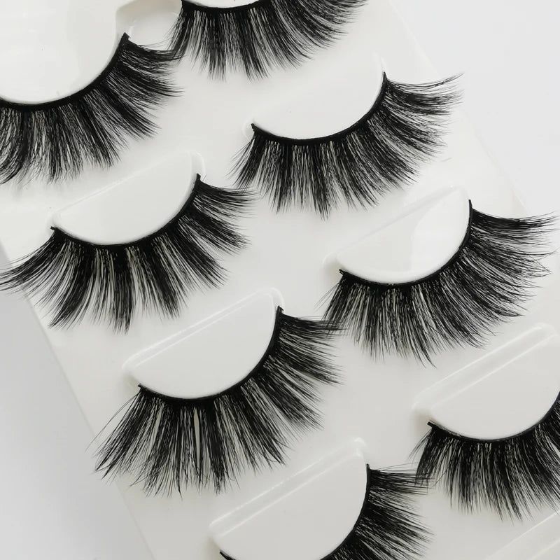 A set of handmade mink strip eyelashes displayed on a white background.