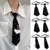 Black gothic crystal rhinestone bow tie necktie worn on a white shirt
