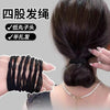 Black elastic hair ties used to secure a ponytail on a woman's head.