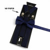 A black suspenders set with a navy blue bow tie and strap, featuring a silver buckle.