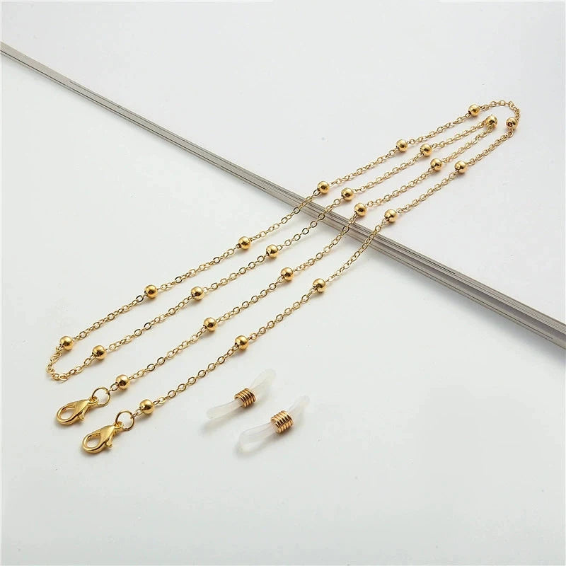 Gold metal beads sunglasses chain for eyewear displayed on a white background