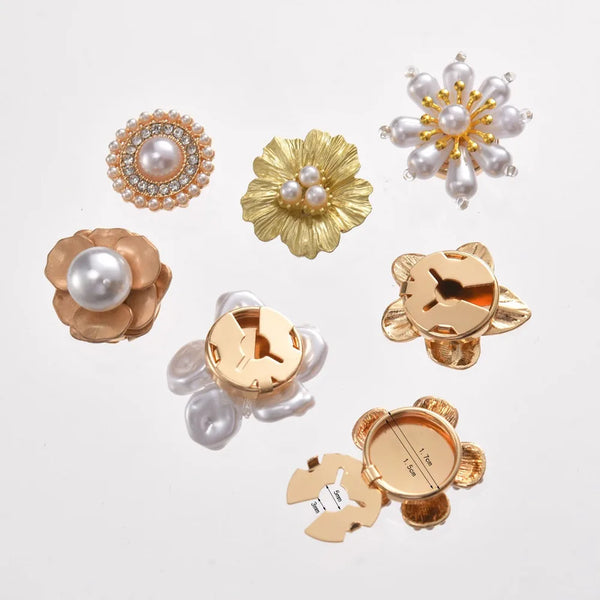 A collection of floral button cufflinks featuring pearl and gold accents for formal wear.