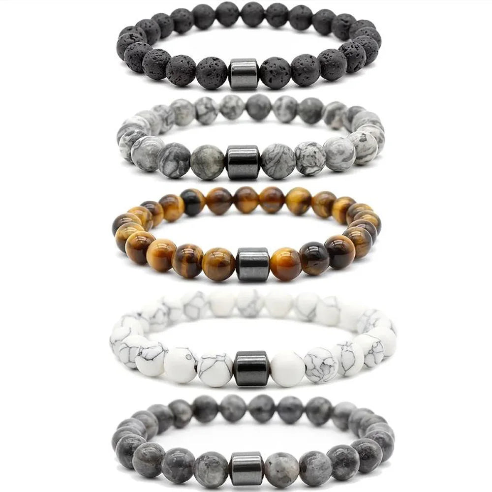 A stack of five Tiger Eye Lava Map bracelets in varying sizes and shades of brown and gray.
