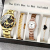 A gift box contains a gold-toned watch, a gold chain, and a rose gold watch with a heart pendant.
