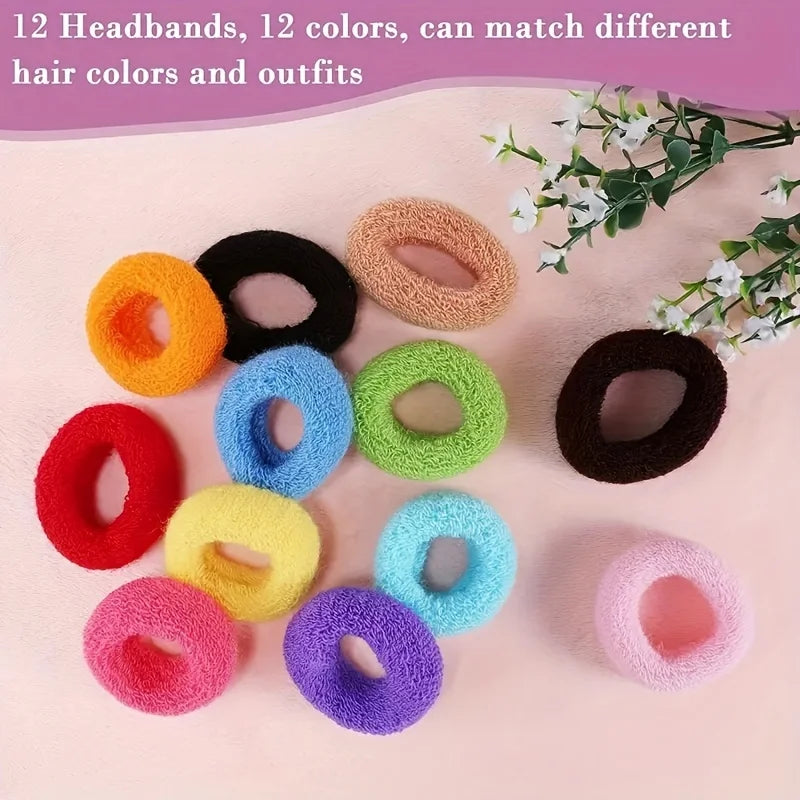 A collection of 12 multi-colored cotton elastic hair ties in various shades are displayed on a pink surface.