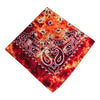 A square bandana scarf featuring an intricate paisley design in white on a vibrant orange and red background.