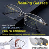 Pair of photochromic progressive reading glasses shown on a dark surface with a hand, demonstrating light-sensitive lenses.