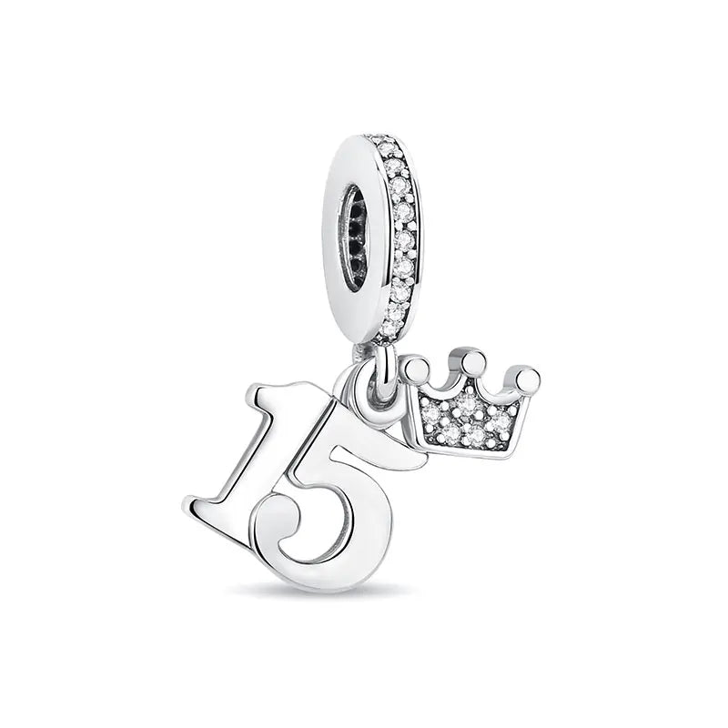 A silver family tree charm jewelry piece featuring the number 15.
