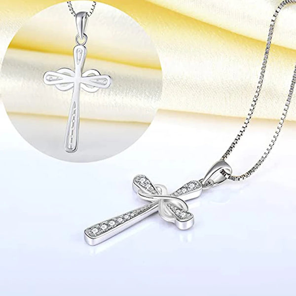 Silver cross pendant necklace for women featuring a detailed design and chain.