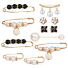 A collection of gold-toned adjustable pearl jewelry including bracelets, earrings, and brooches.