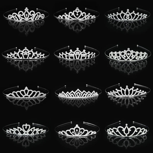 A collection of silver crystal princess tiara and crown hair accessories displayed against a black background.