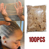 A hand is holding a transparent hair net, next to a clear plastic bag filled with 100 pieces of natural-colored hair nets.