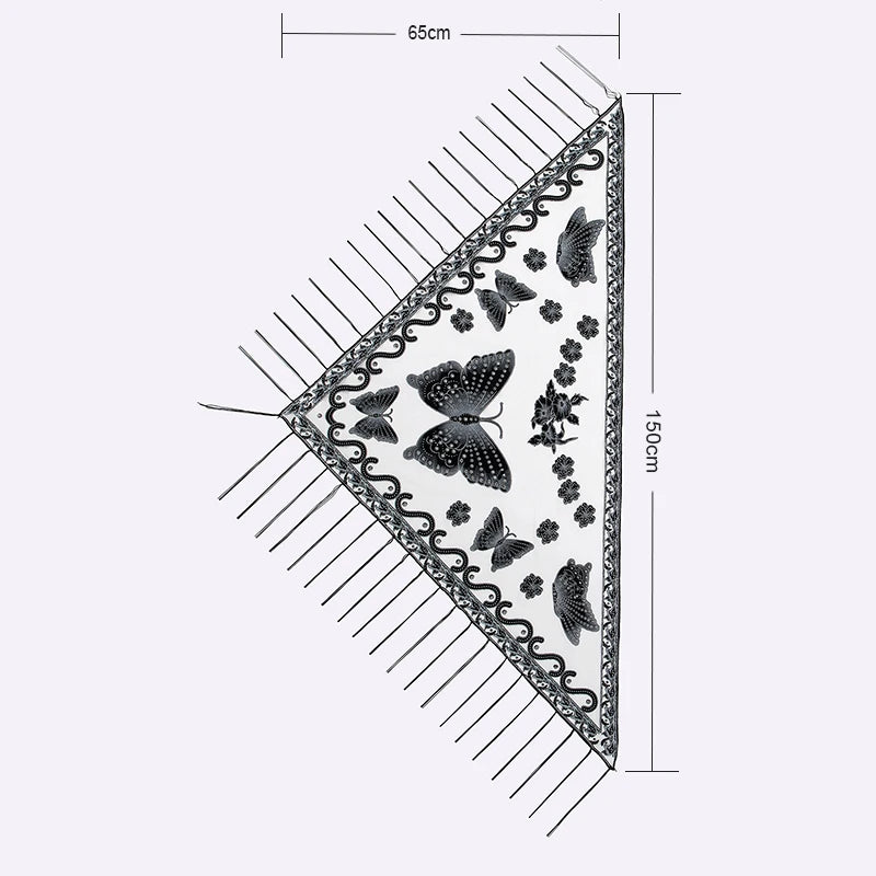 A rectangular lace scarf or shawl featuring an elegant printed butterfly pattern and fringed edges.