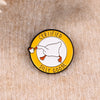 A yellow enamel pin featuring a white goose drinking from a small cup, labeled Certified Silly Goose.