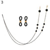 A delicate black chain lanyard with a gold-toned clasp and small black pearl beads.
