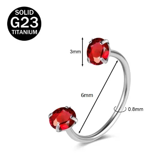 A close-up view of a solid titanium G23 nose ring featuring a red CZ crystal gemstone.