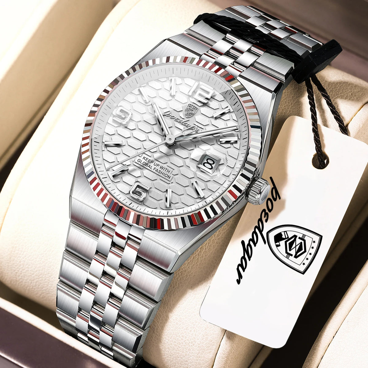 A silver luxury quartz women's wristwatch with a metal bracelet is displayed in a light-colored box.
