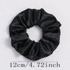 Black satin elastic hair ties gathered into a bow shape