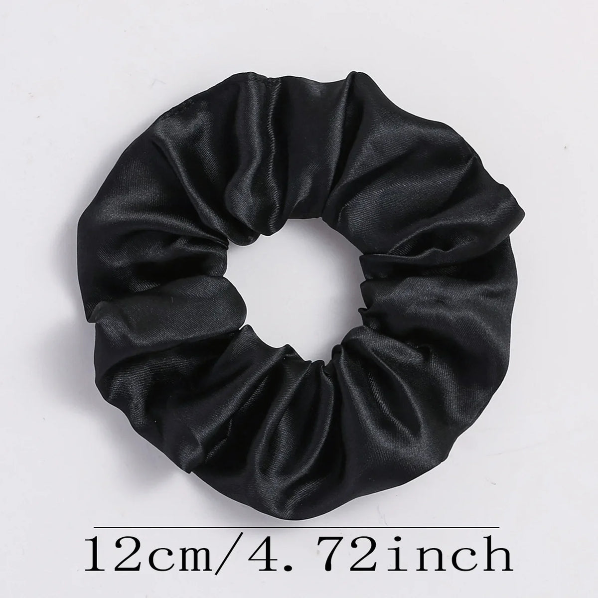 Black satin elastic hair ties gathered into a bow shape