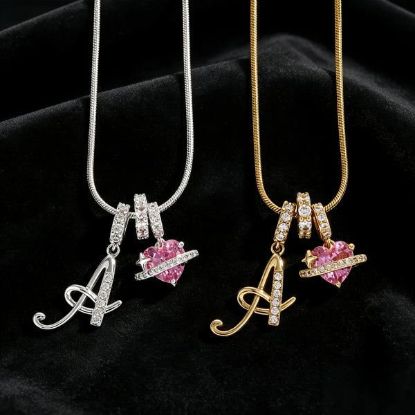 A pair of gold and silver alphabet flower pendant necklaces displayed on black velvet fabric.