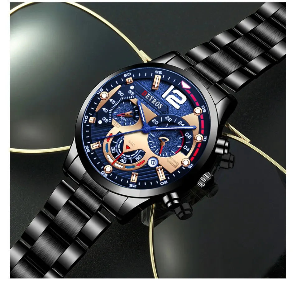 A black men's stainless steel quartz watch with a blue dial and gold accents on a dark background.