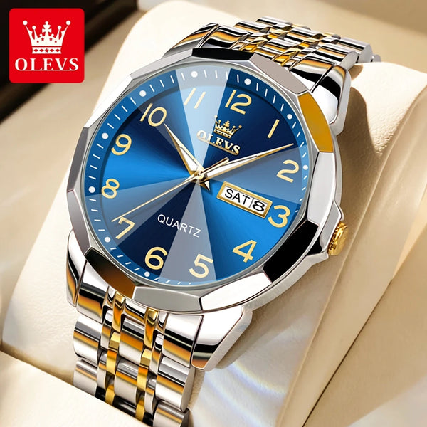 A silver and gold-toned quartz wristwatch with a blue dial and crown logo displayed on a light background.