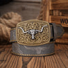 A brown PU leather belt with a silver floral engraved buckle and a dark gray leather strap resting on a wooden surface.