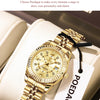 A gold-toned Poedagar quartz wristwatch is displayed on a cream-colored box, highlighting its elegant fantasy style.
