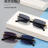 Rimless rectangle sunglasses in black and purple shades displayed on a white box.