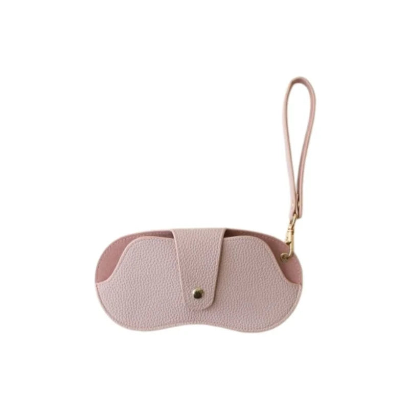 A light pink PU leather eyewear storage case with a thin strap.