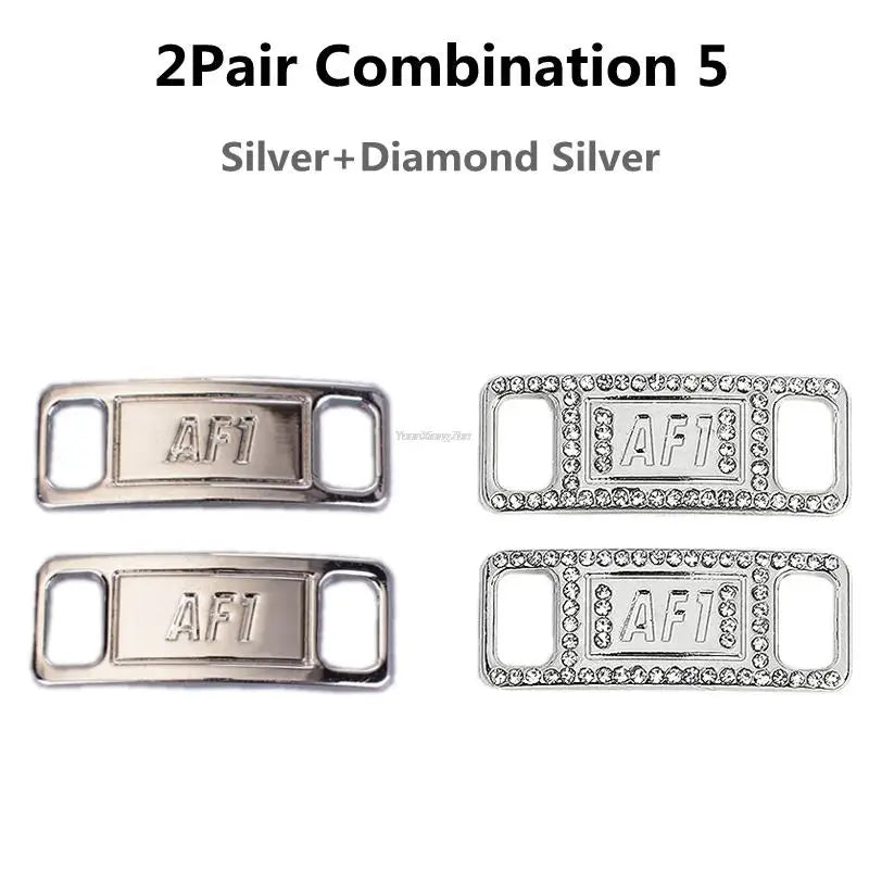 A pair of silver and diamond silver shoe charms and laces combination set.