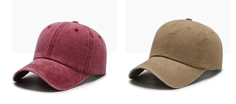 A pair of casual baseball caps, one in maroon and one in olive green, shown from the side.