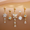 A set of five gold stainless steel dangled belly button rings featuring various diamond and gemstone designs.