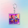 Silver keychain featuring a pixel art illustration of two characters from Retro Vice City