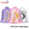 Three silk satin wig bags in purple, pink, and white are displayed for storage.