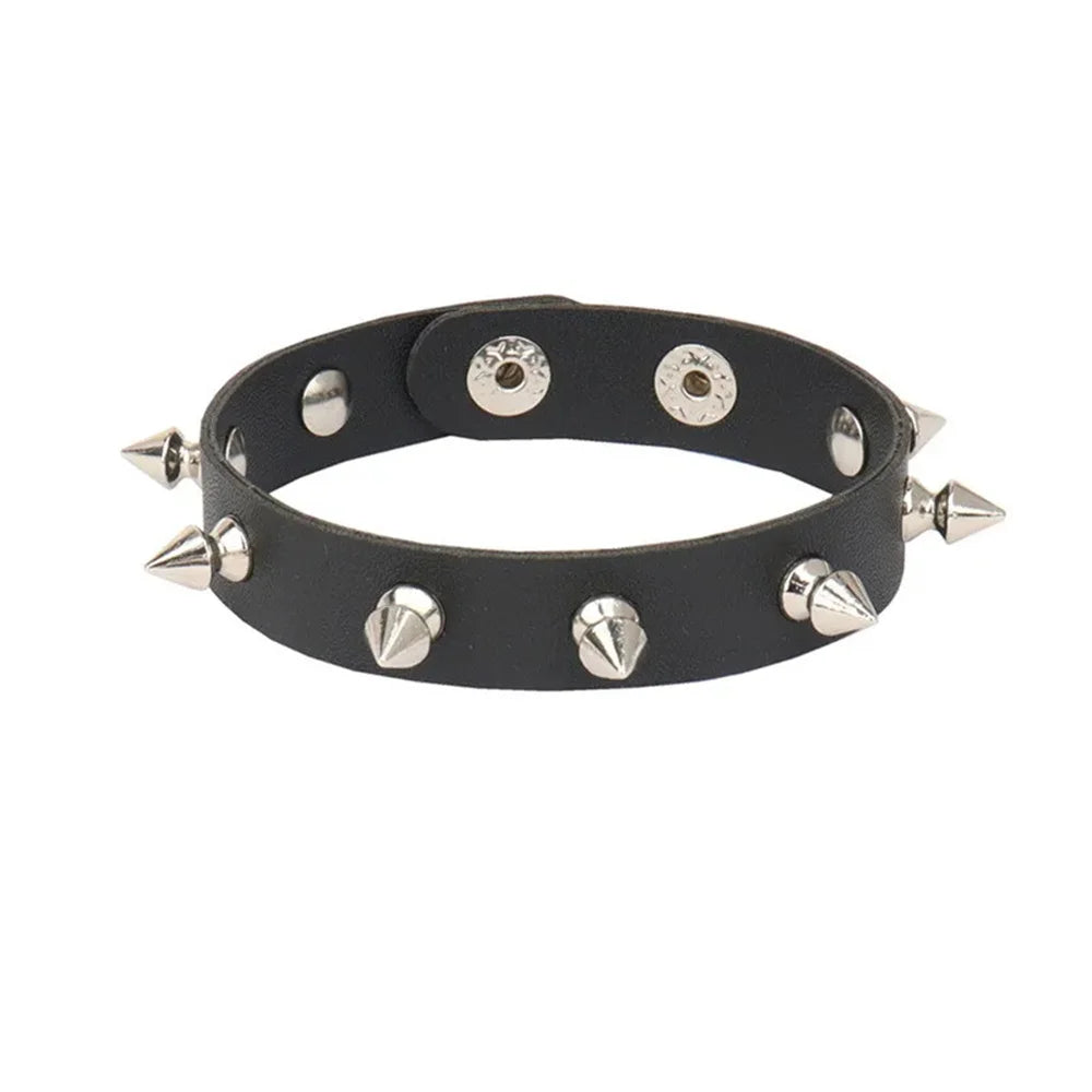 Set of black leather cuff bracelets with silver spikes and studs