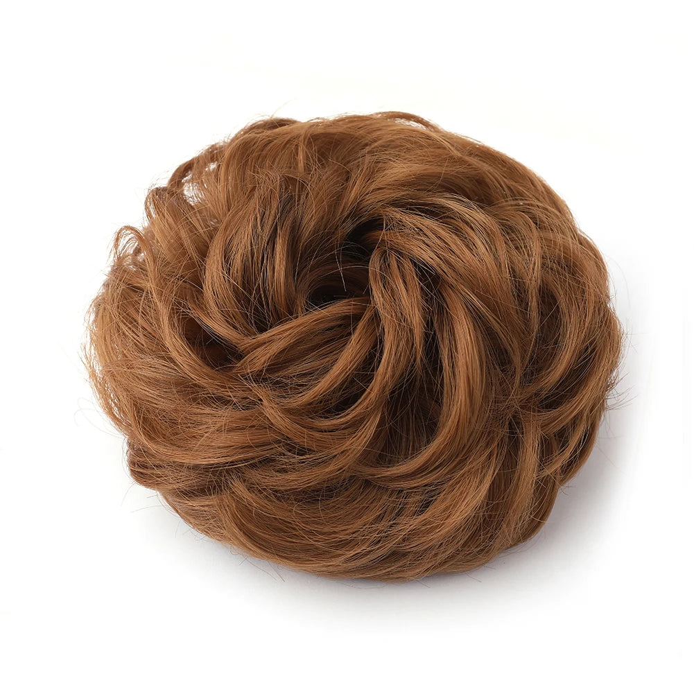 A tightly twisted, voluminous brown hair piece used for a messy bun or curly updo.
