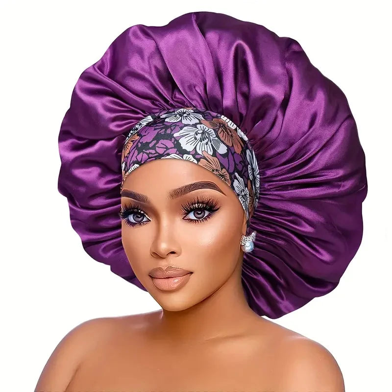 A woman wearing a purple satin sleep bonnet with an embroidered headband.