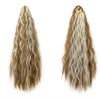 A pair of long, wavy brown and blonde hair extensions shown in a ponytail style.
