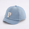 Light blue denim baseball cap with a beige letter P embroidered on the front